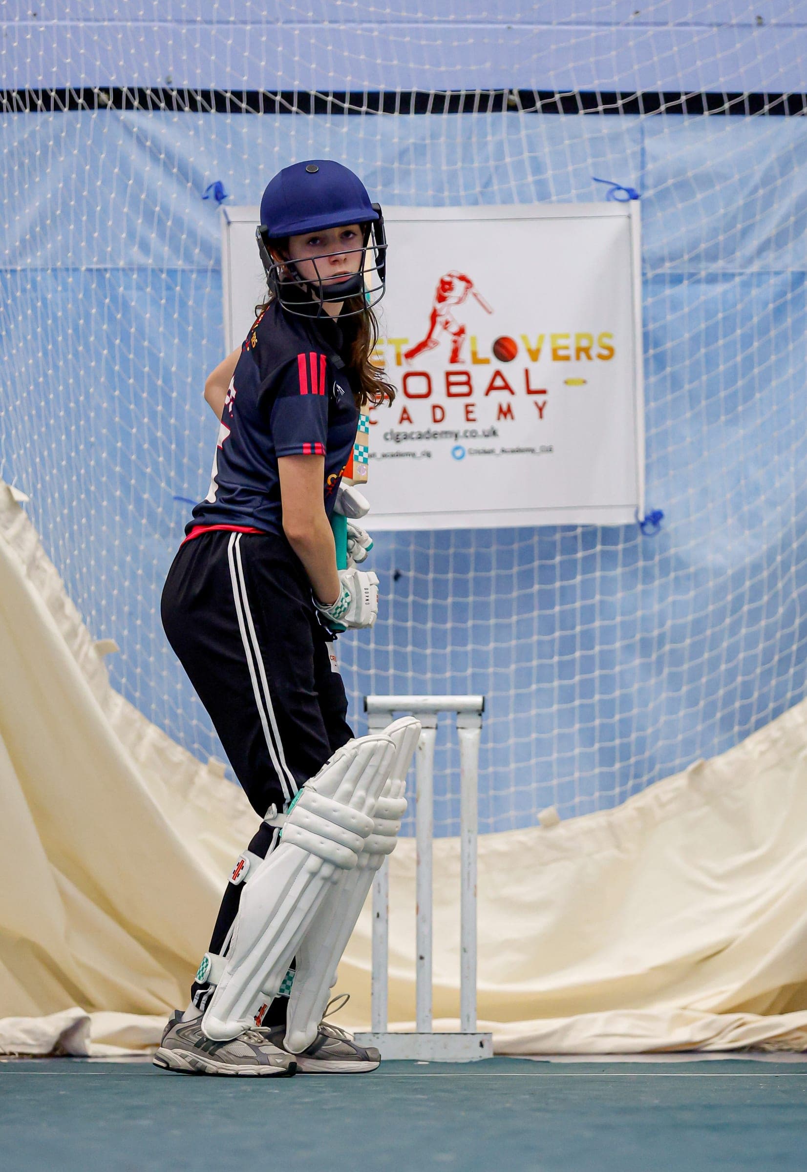 Girl batting at the stumps