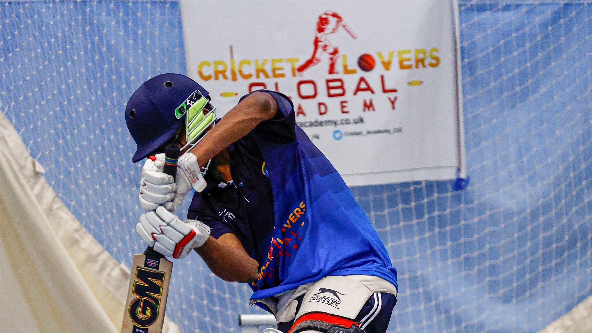 Player batting in academy nets