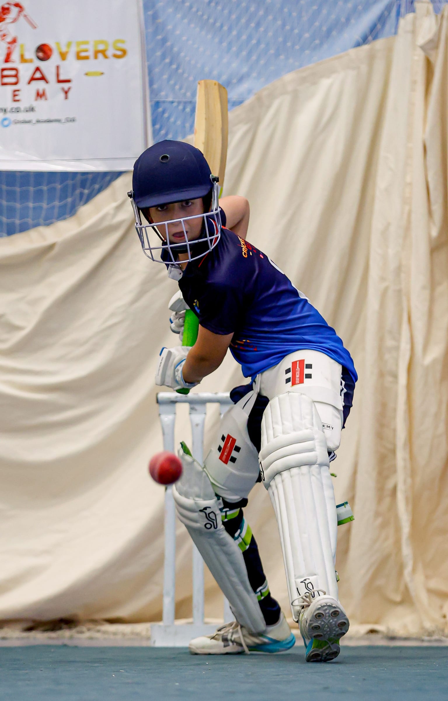 Young player batting in nets