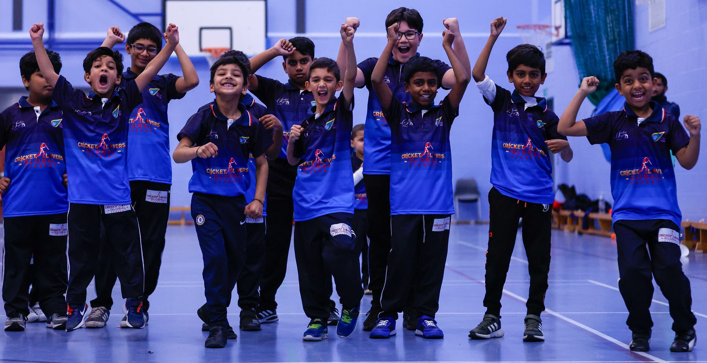 Academy players celebrating together